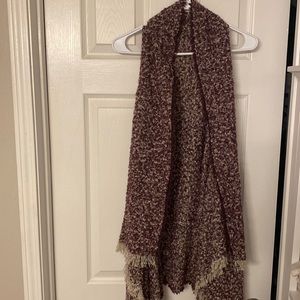 Purple sleeveless poncho/cardigan.